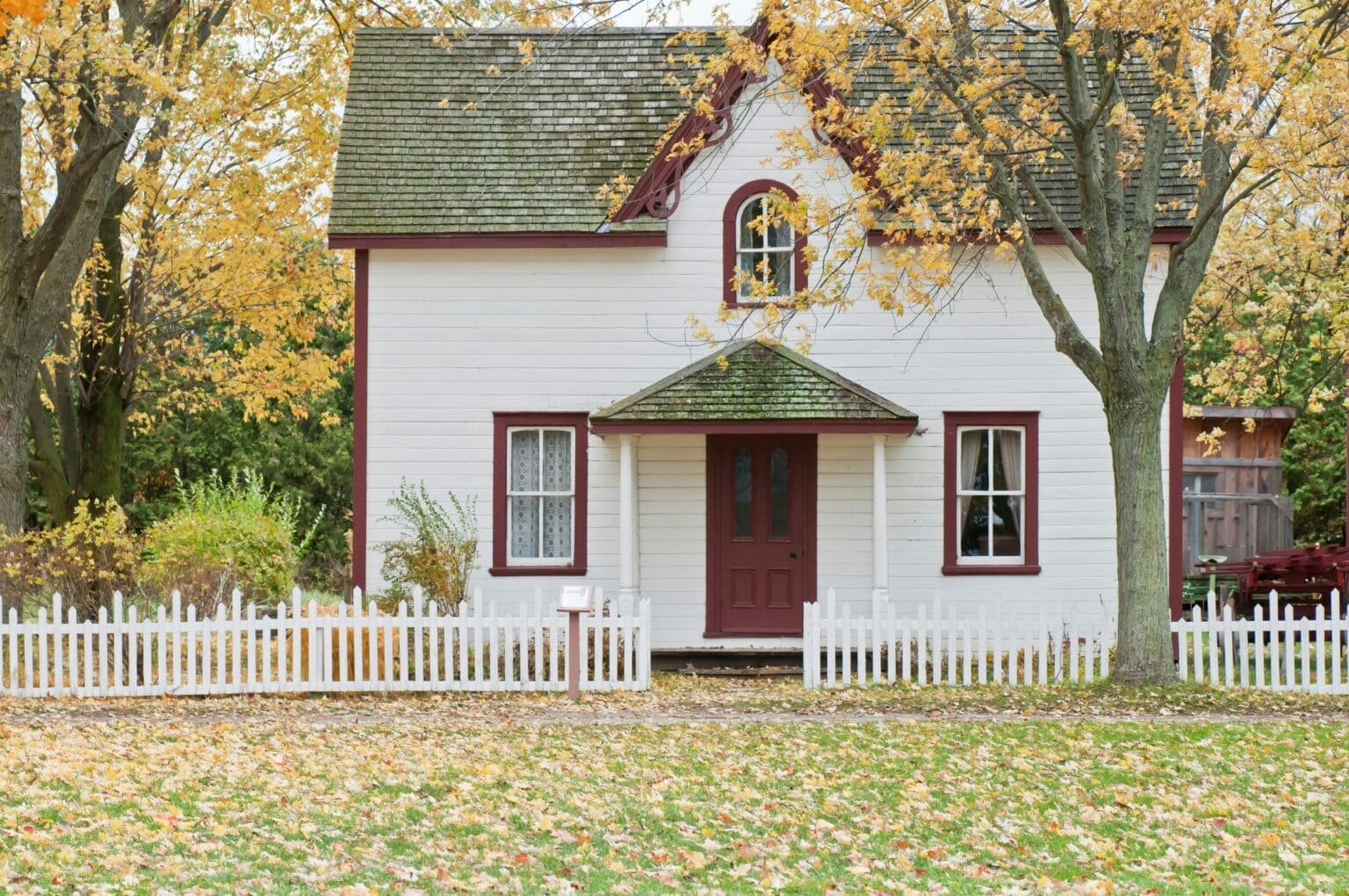 House in the fall. Leaves scattered on the ground. Sell your house fast for cash in Westlake, TX.