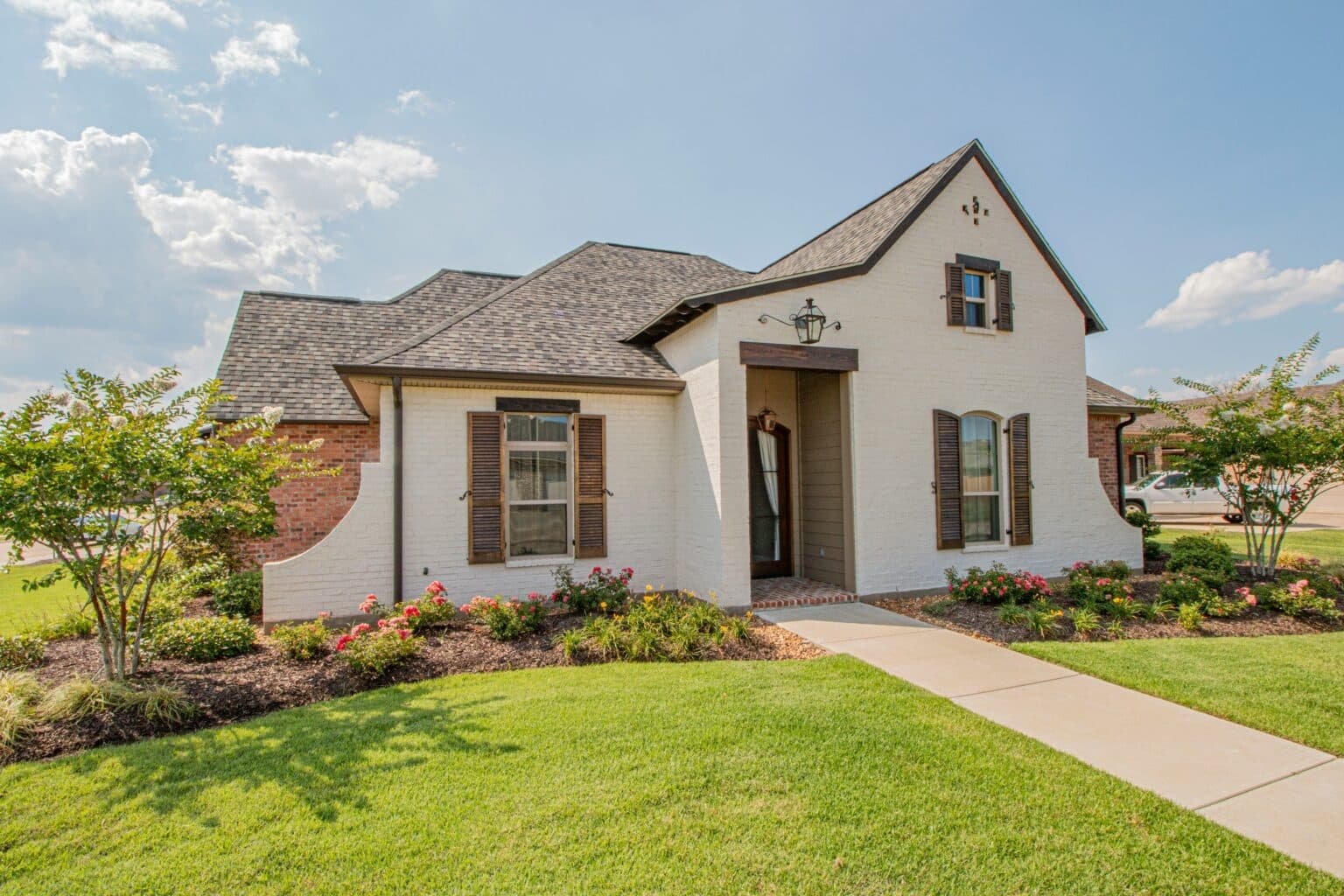 Mexican-style home with a lush lawn. sell your house fast for cash in Grand Prairie